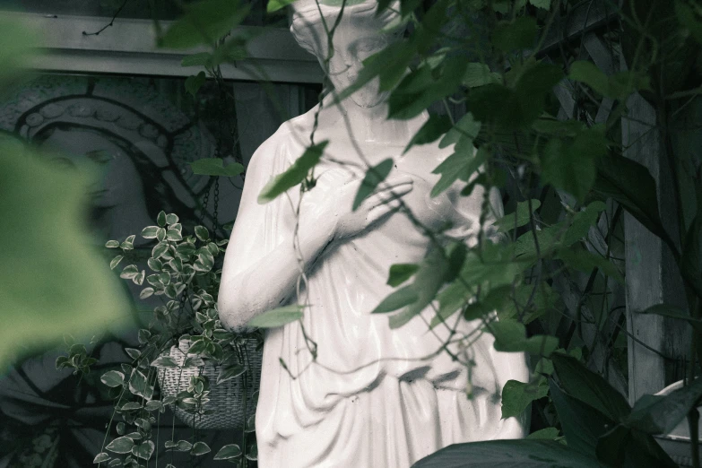 a statue of a lady in an outdoor area