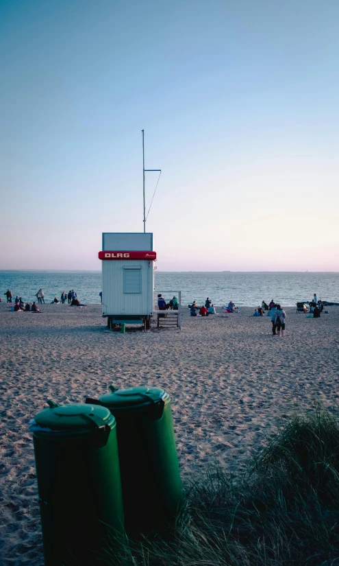 there are many people on the beach by the water