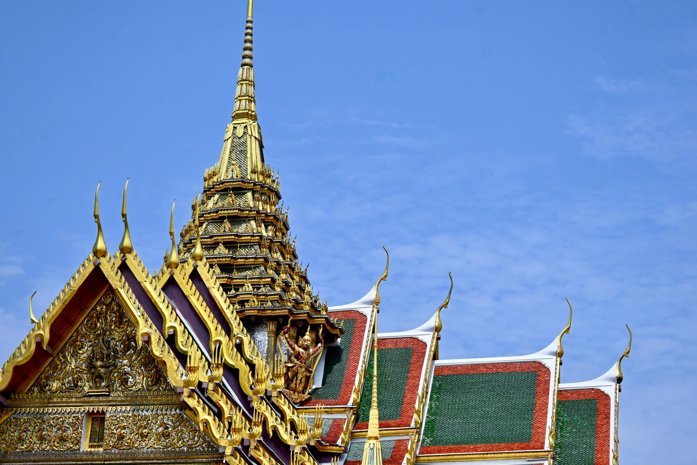 an ornate structure in the middle of a blue sky