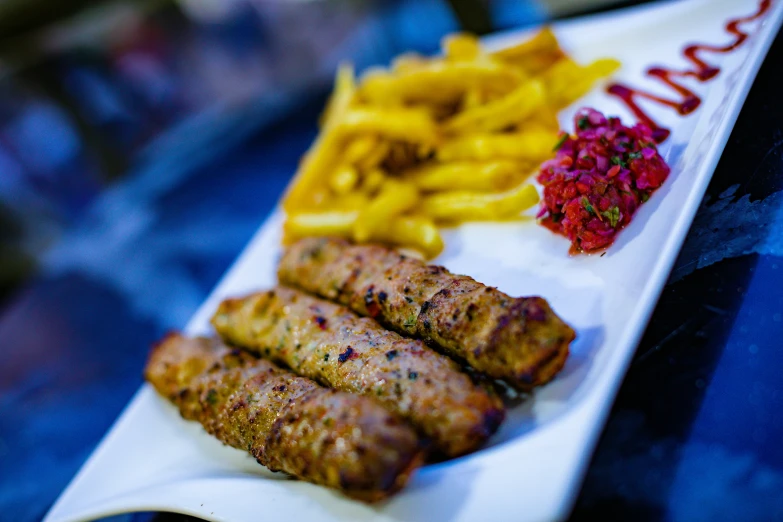 there are some food items and fries on the tray