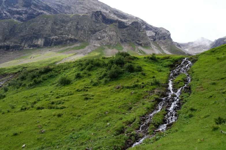 a hillside with water running in it