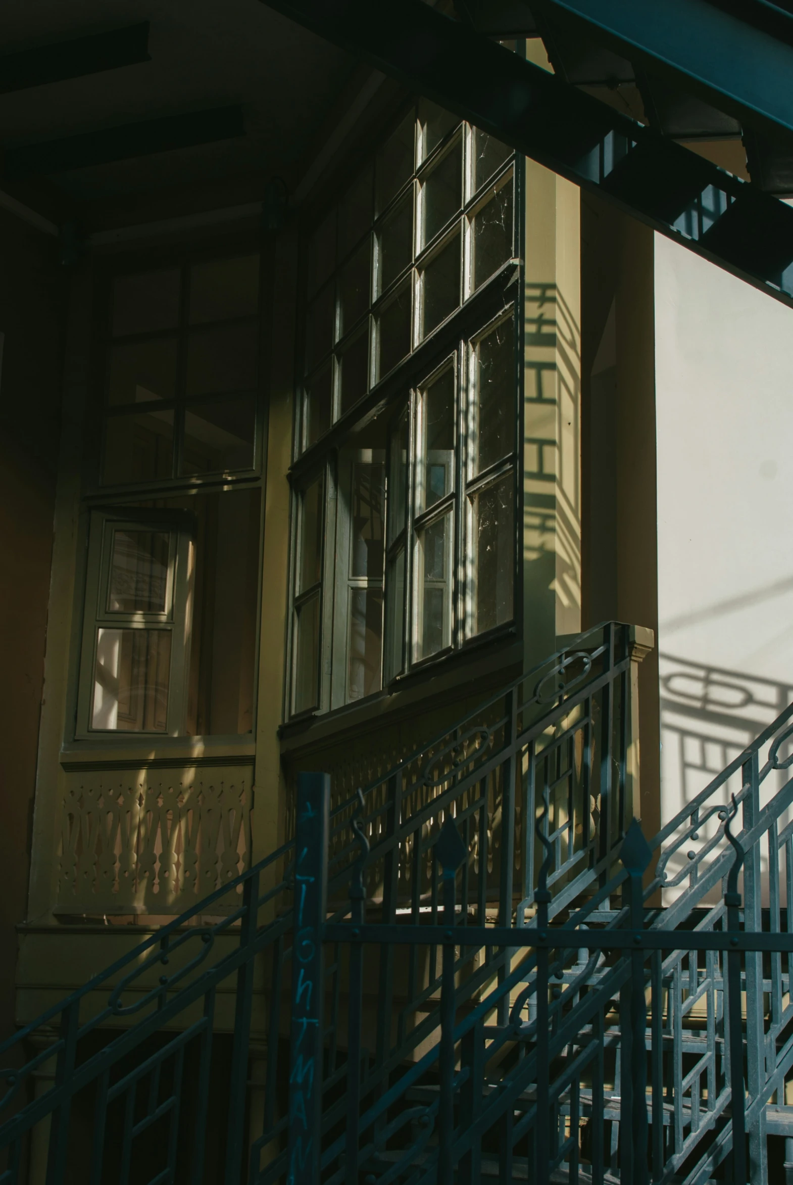 the shadows from a large window create a dramatic silhouette