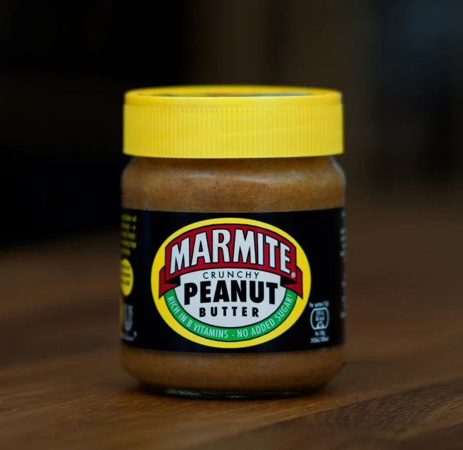 a jar of peanut er on a wooden table