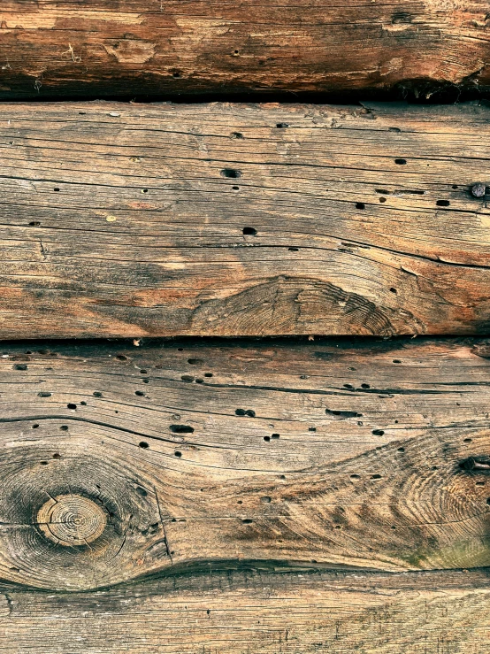 the wall made out of different wood with holes