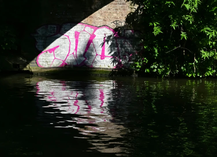 the image of water is in front of a concrete wall