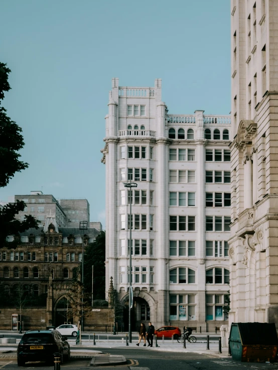 a building on a city street next to other buildings