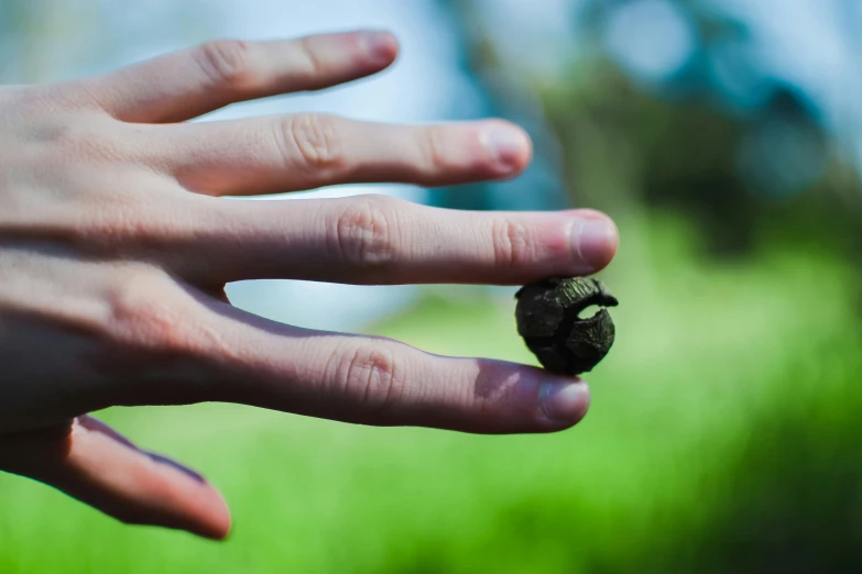 someone with the hand of their child holding an object in his hand