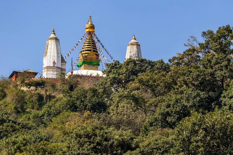 the temple on top of the hill, with a mountain in the background