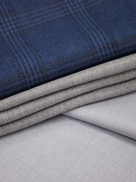 blue and grey checkered wool fabric, three are folded