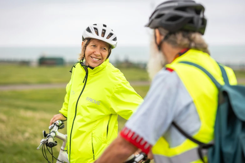 a woman and man on bicycles with a backpack and backpack