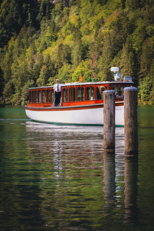 a boat is docked on the water by a dock