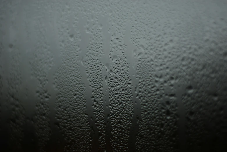 a close up view of raindrops on the glass