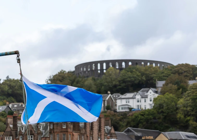 a flag that is flying on top of a pole