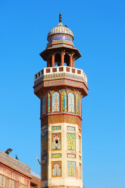 a tall tower structure with a colorful design on it