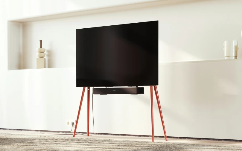 this is a black television on wooden legs