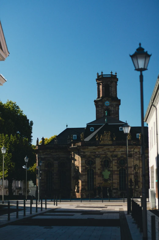 an old church with a clock tower sits in the distance