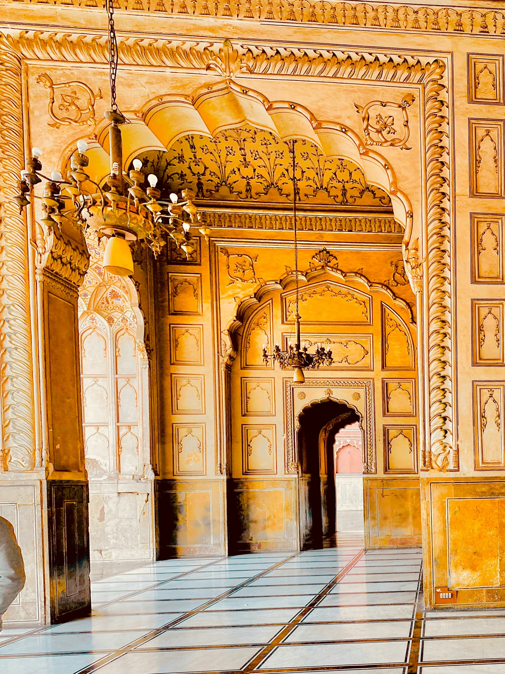 a man and woman stand in an elaborately designed building