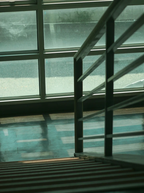 a person walks by a window on a rainy day