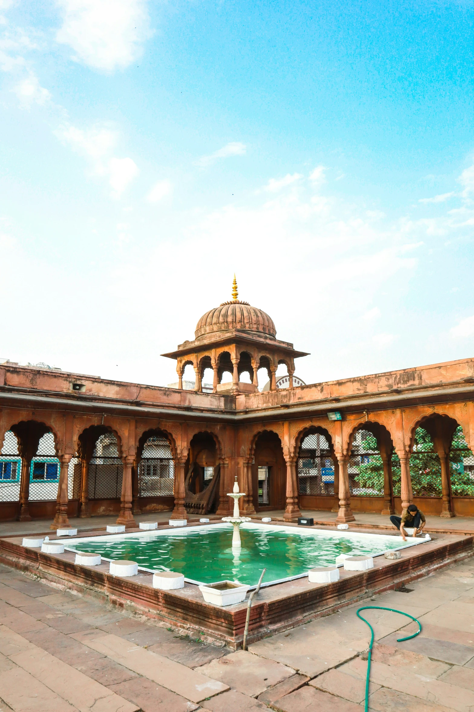 the architecture of a courtyard with a fountain