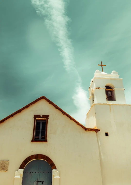 an image of a building that is under the clouds