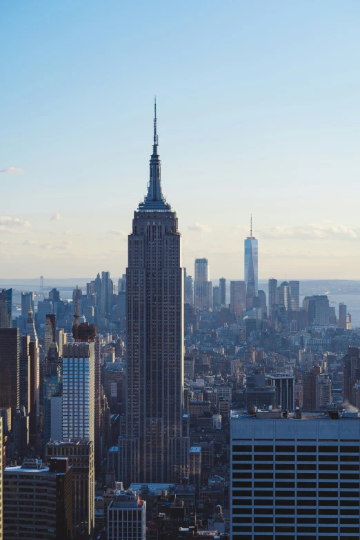 the skyline of a large city in front of the tall buildings