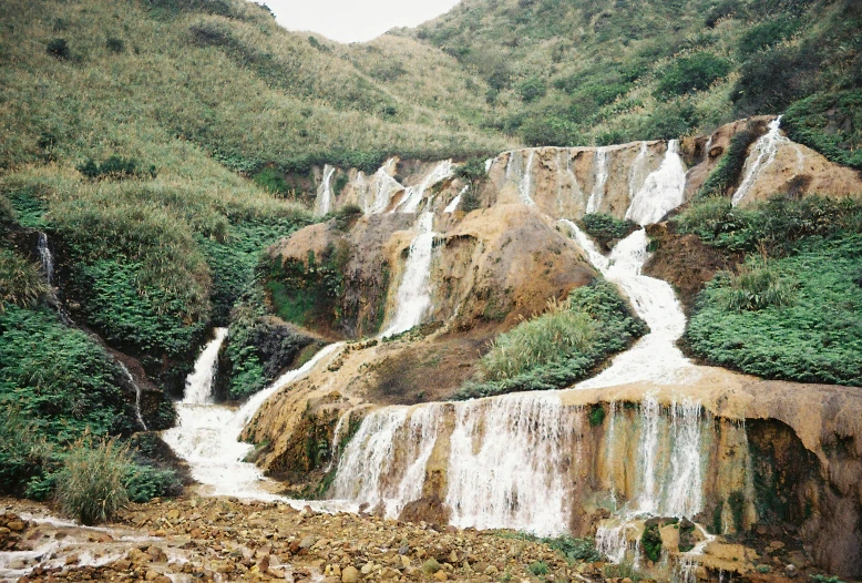 waterfall in the mountains on a windy day