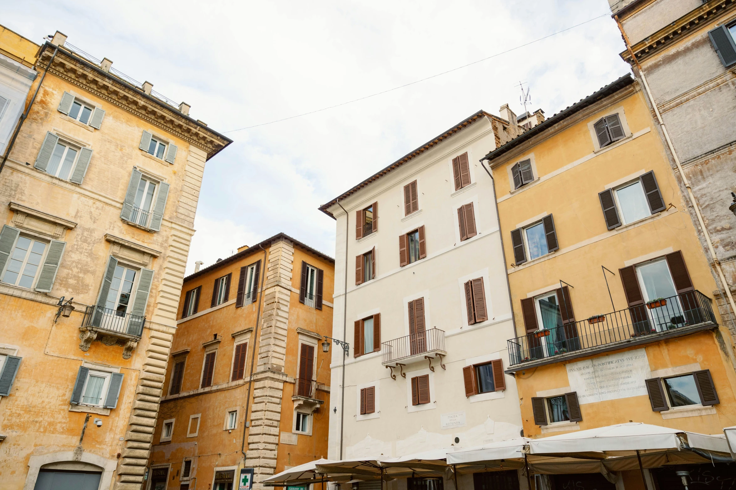 a few buildings line a street next to each other