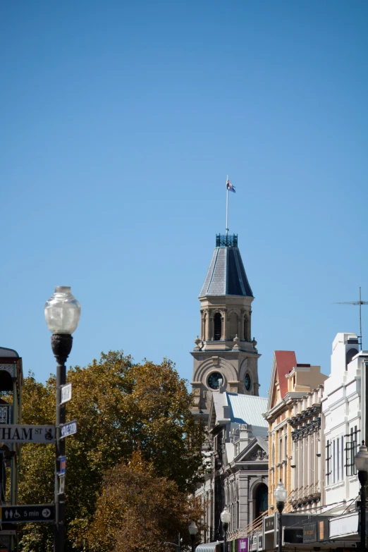 a very tall clock tower with a sky background