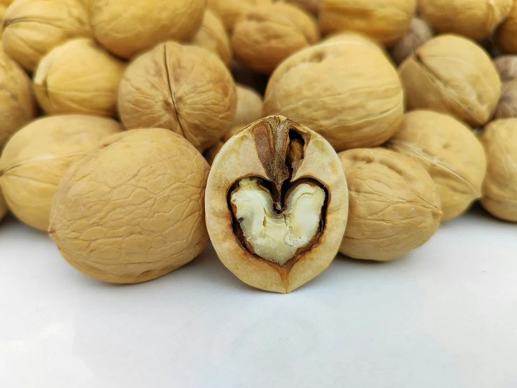 a whole nut with a heart shaped core