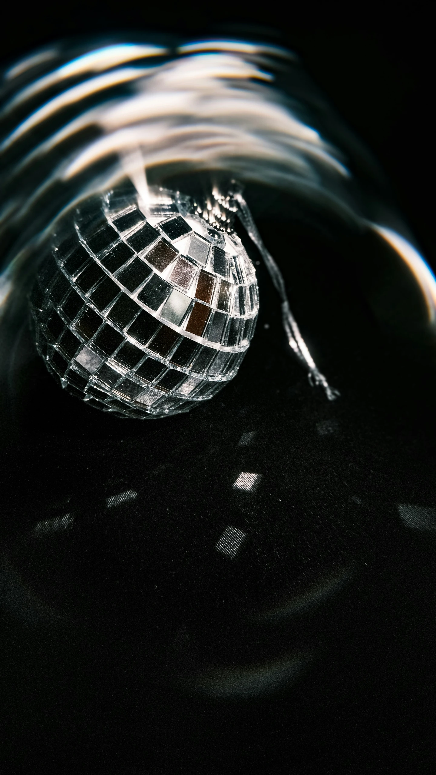 a silver object sitting inside of a black bowl