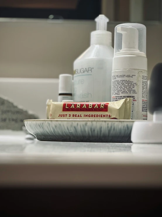 several hair care products sitting on a bathroom sink