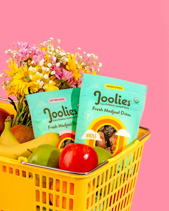 a basket filled with fresh produce and books on it