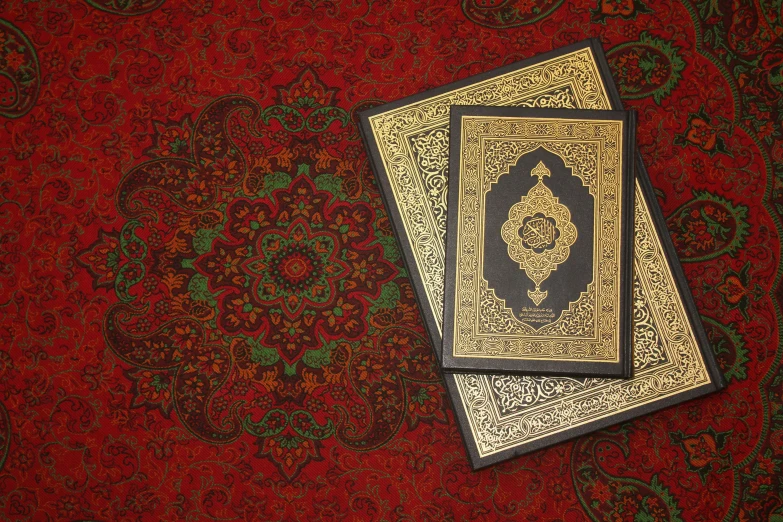 a couple of books that are on a rug