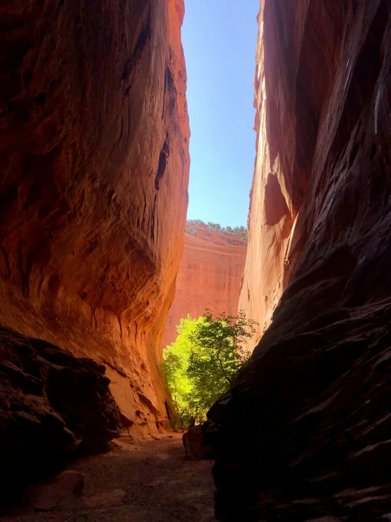 a narrow rock path going through an canyon