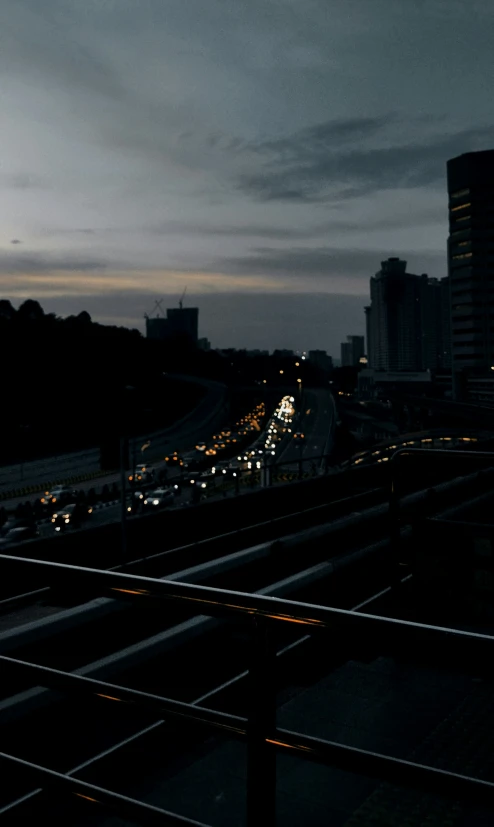 traffic on a freeway with building in the background