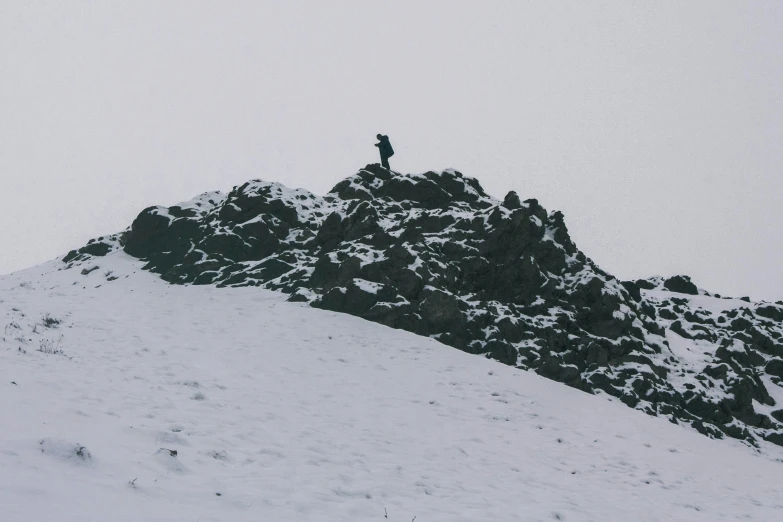 a man riding skis down a snow covered slope