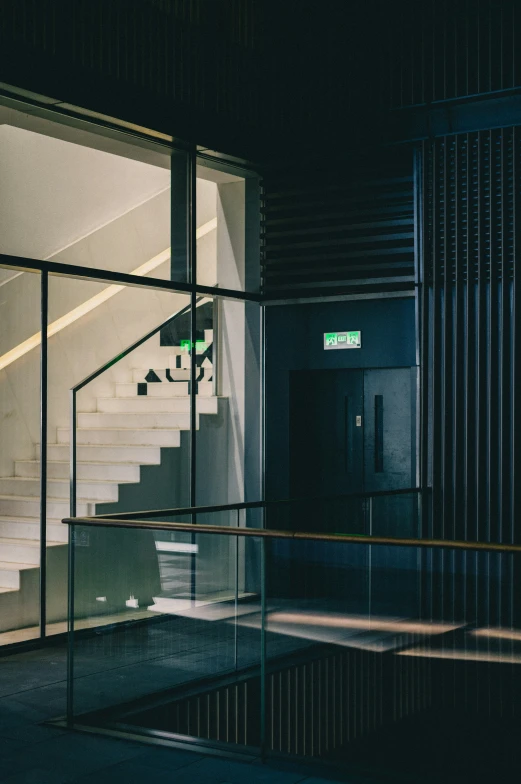 the stairs in this stairwell are glass to take up