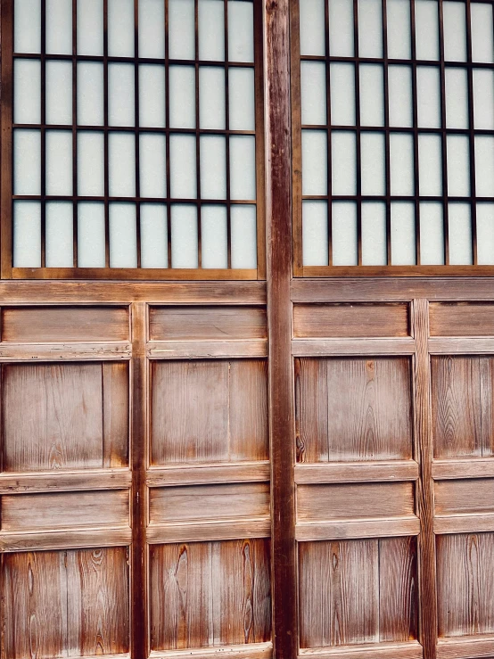 a large wooden wall that has squares on it