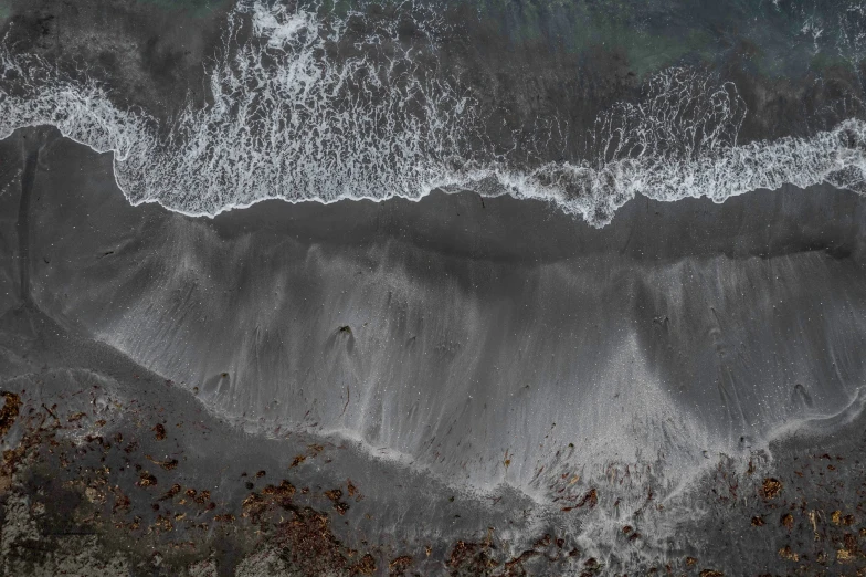 waves rolling in to the shore near shore line