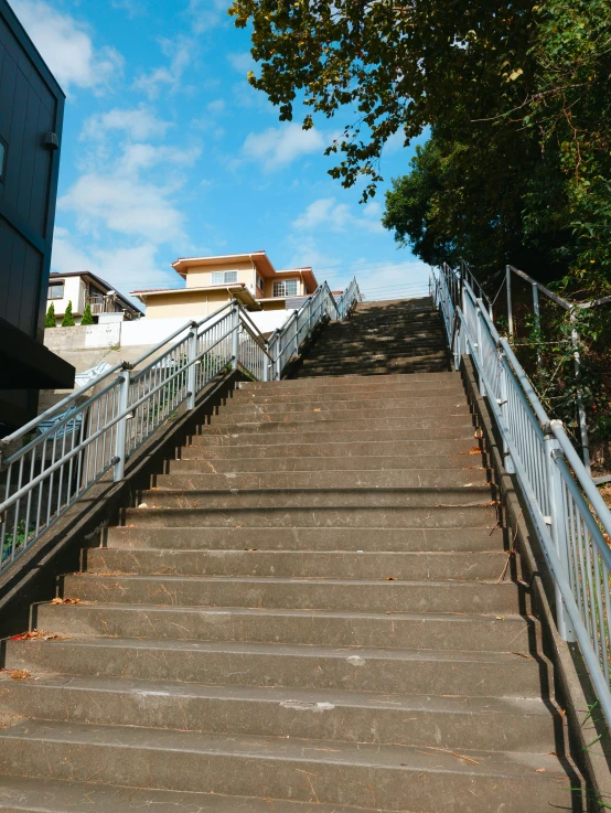 a group of cement stairs that is next to a building