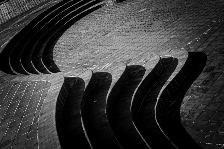 an image of black and white lines that are on the sidewalk