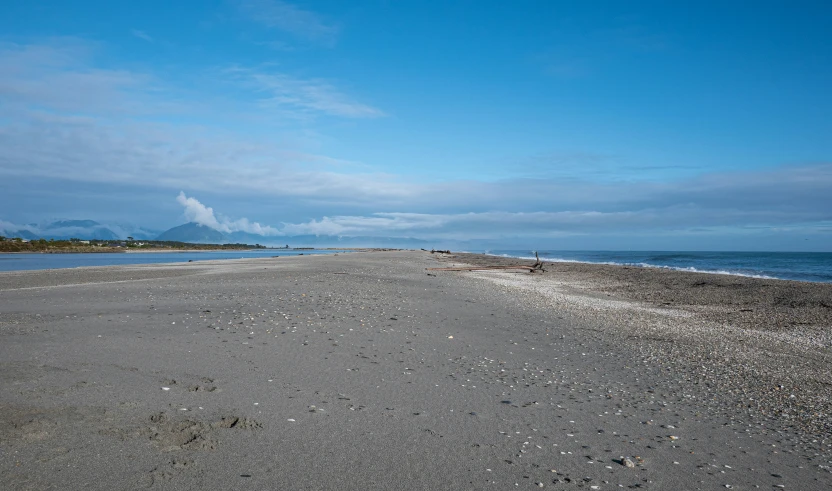 a person on a bench near an ocean