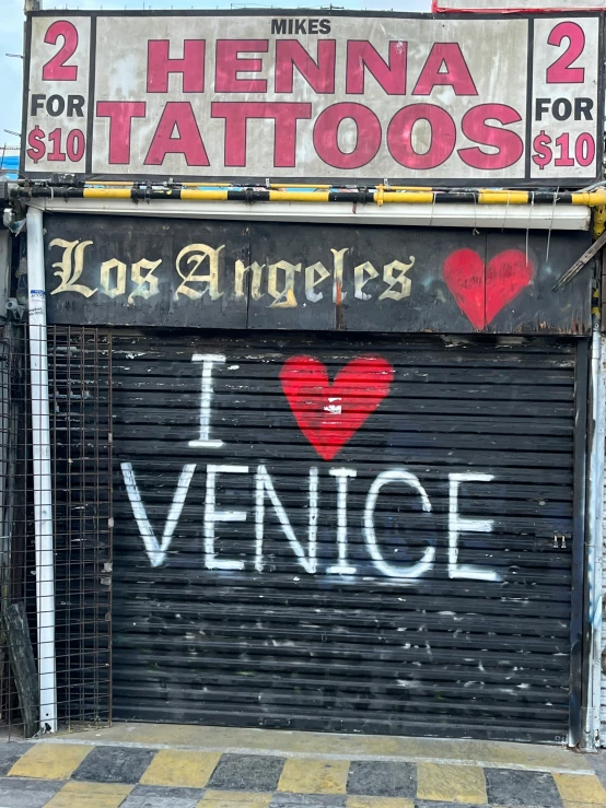 a restaurant that has been painted red and black and features i love venice