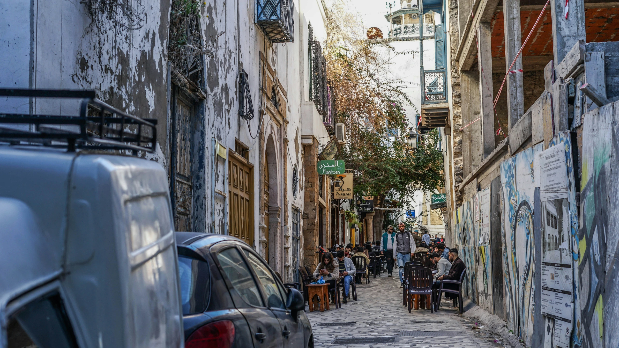 a street with lots of graffiti on it