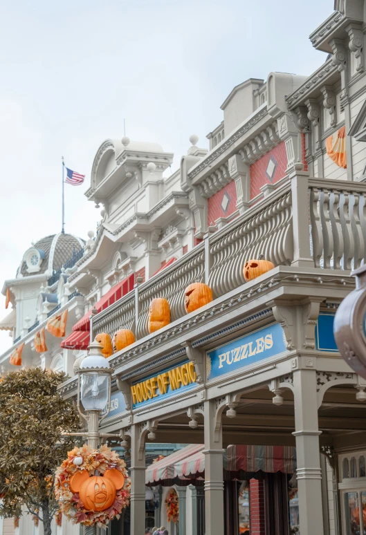 the front of a building that has halloween decorations hanging in front of it