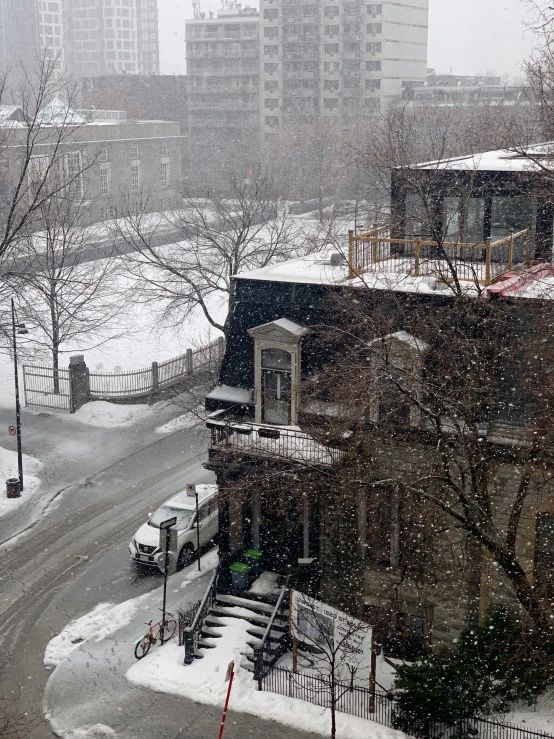 the snow covered streets are quiet in the city