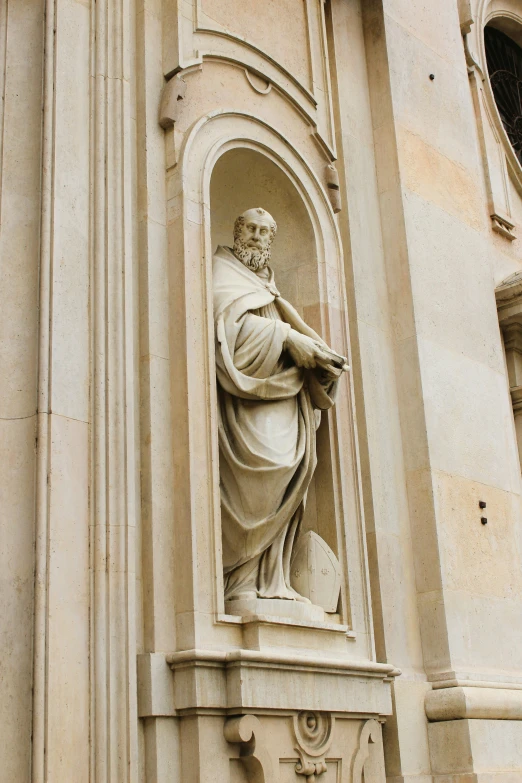 the statue in the church is wearing a robe