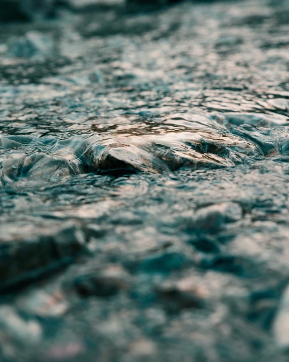 water is rushing over some rocks and rocks