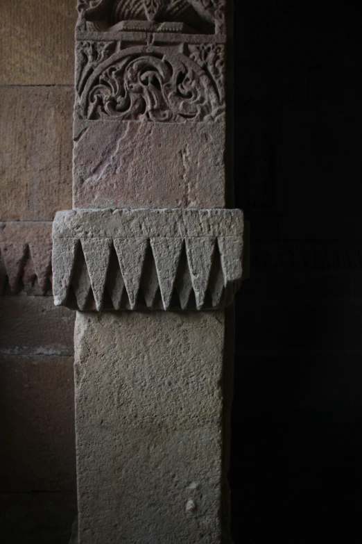 a large brick sculpture with ornate carvings on it