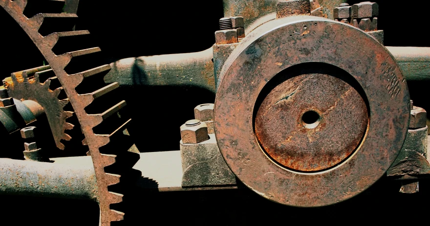 a big rusty piece of metal that looks like gears